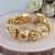 18k gold plated ethnic adjustable white pearl & ghungroo bracelet for women & girls (adb173fl)