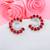 Red color american diamond earrings