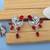Red color american diamond earrings