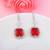 Red color american diamond earrings