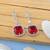 Red color american diamond earrings