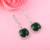 Green color american diamond earrings