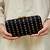 Black silk embroidered clutch