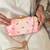 Pink silk embroidered clutch