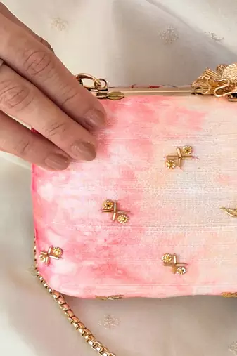 Pink silk embroidered clutch