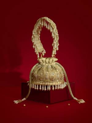 Gold silk floral embroidered potli bag 1