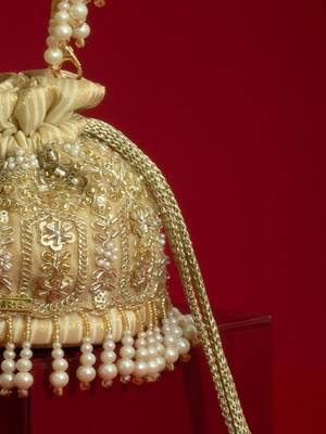 Gold silk floral embroidered potli bag 3