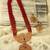 Ad emeralds studded red beads layered long necklace