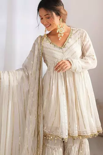 White mal chnaderi silk mirror work and hand work sharara set