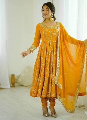 Yellow hevay faux georgette embroidery work gown 1