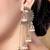 Gold plated fancy multi layered dangle jhumka earrings for women 