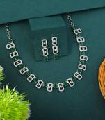 Green color american diamond necklace set adorned with classic stone design