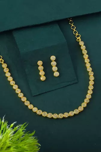 Gold color american diamond necklace set with diamond-like centerpiece charm