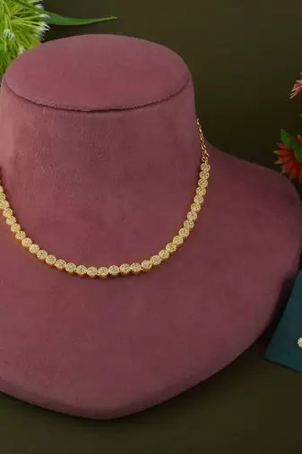 Gold color american diamond necklace set with diamond-like centerpiece charm