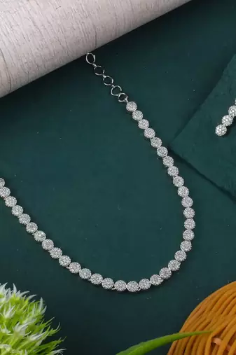 Silver color american diamond necklace set with pearl-like embellishments