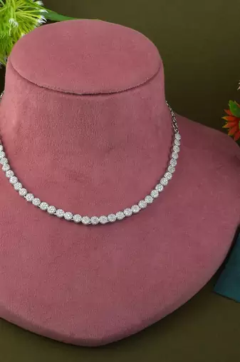Silver color american diamond necklace set with pearl-like embellishments
