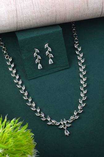 Silver color american diamond necklace set featuring crystal droplet design