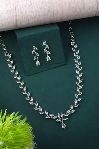 Silver color american diamond necklace set featuring crystal droplet design