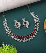 Red color american diamond necklace set with gold-toned leaf accents