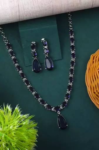 Purple color american diamond necklace set in stylish traditional pattern