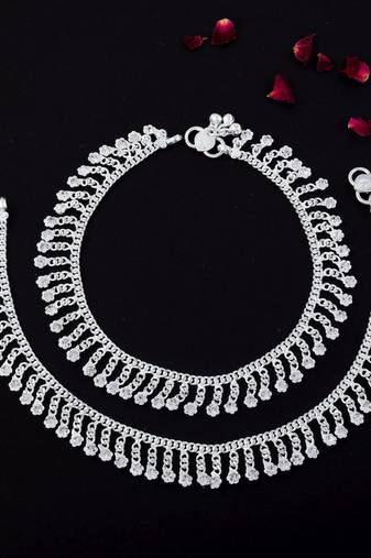 Beautiful silver color anklets designed with traditional indian artistic craft for wedding events