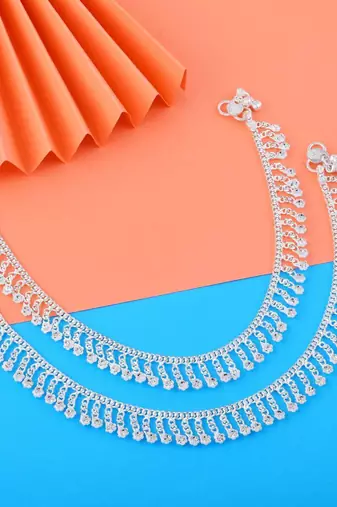 Beautiful silver color anklets designed with traditional indian artistic craft for wedding events
