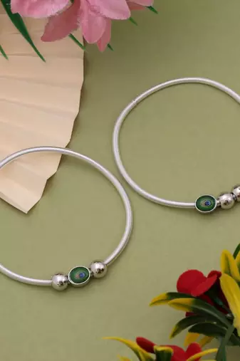 Traditional silver color peacock feather anklet with antique detailing for women and girls