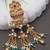 Rajwadi plated adjustable brass finger ring with hanging chains & beads for women (fl273)