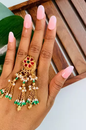 Rajwadi plated brass adjustable finger ring with floral design, pearl beads & green latkan chains for women 