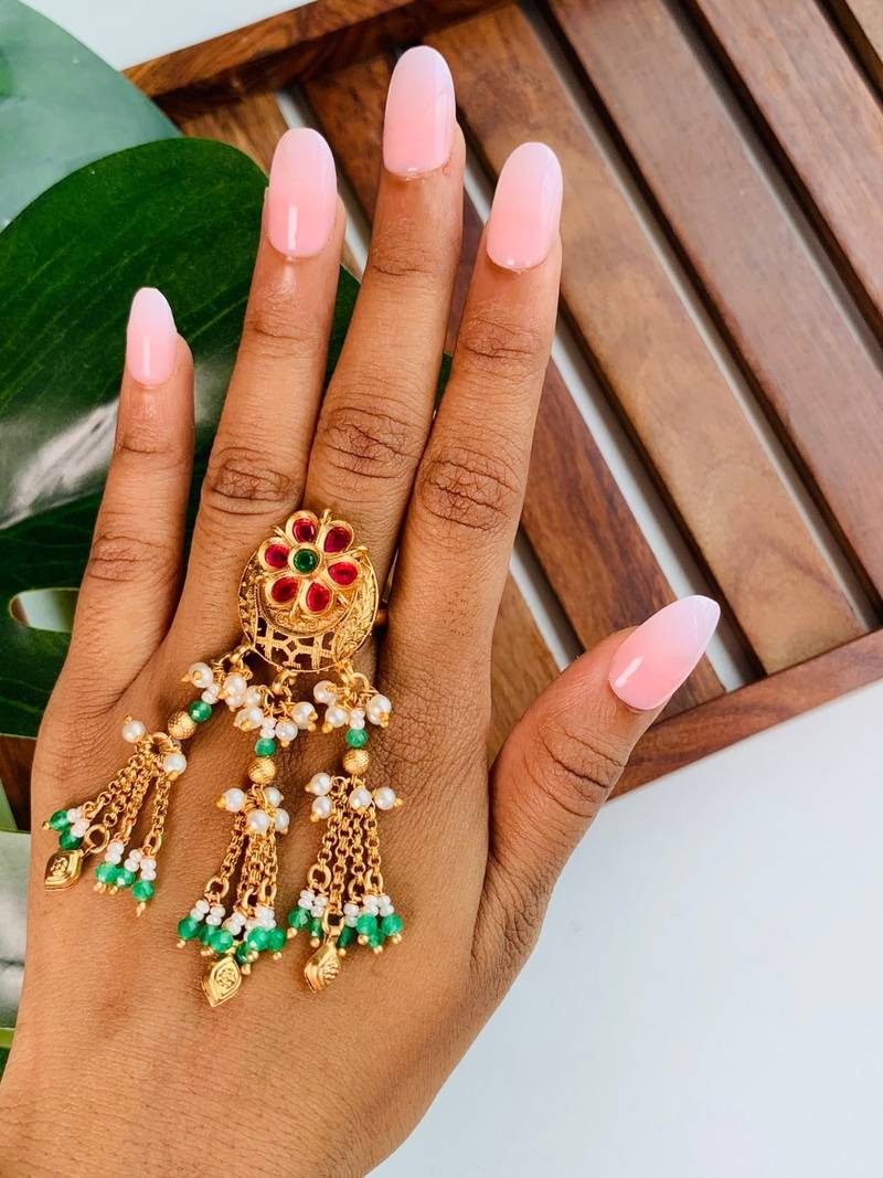 Rajwadi plated brass adjustable finger ring with floral design, pearl beads & green latkan chains for women 