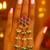 Rajwadi plated brass adjustable finger ring with floral design, pearl beads & green latkan chains for women 