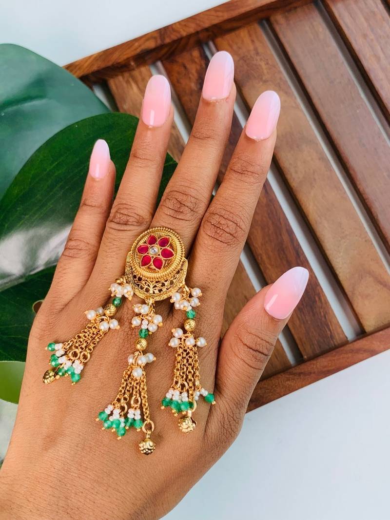 Rajwadi plated brass adjustable finger ring with pearl beads & green latkan chain detailing for women 