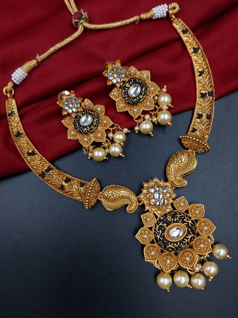​antique gold plated black & gold meenakari necklace set with pearl drops.