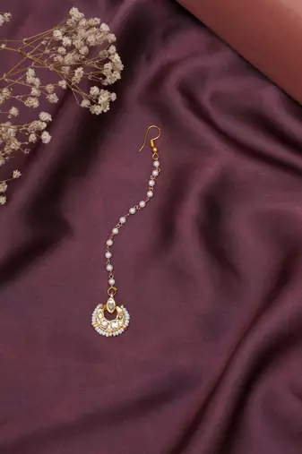  girls gold-plated kundan studded maangtikka