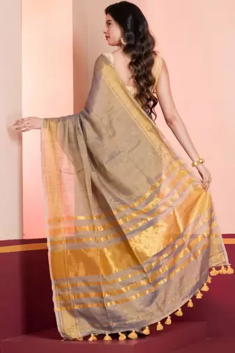 Grey gold dual tone linen tissue saree with zari and tassels, with blouse