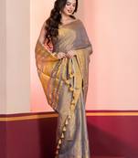 Grey gold dual tone linen tissue saree with zari and tassels, with blouse