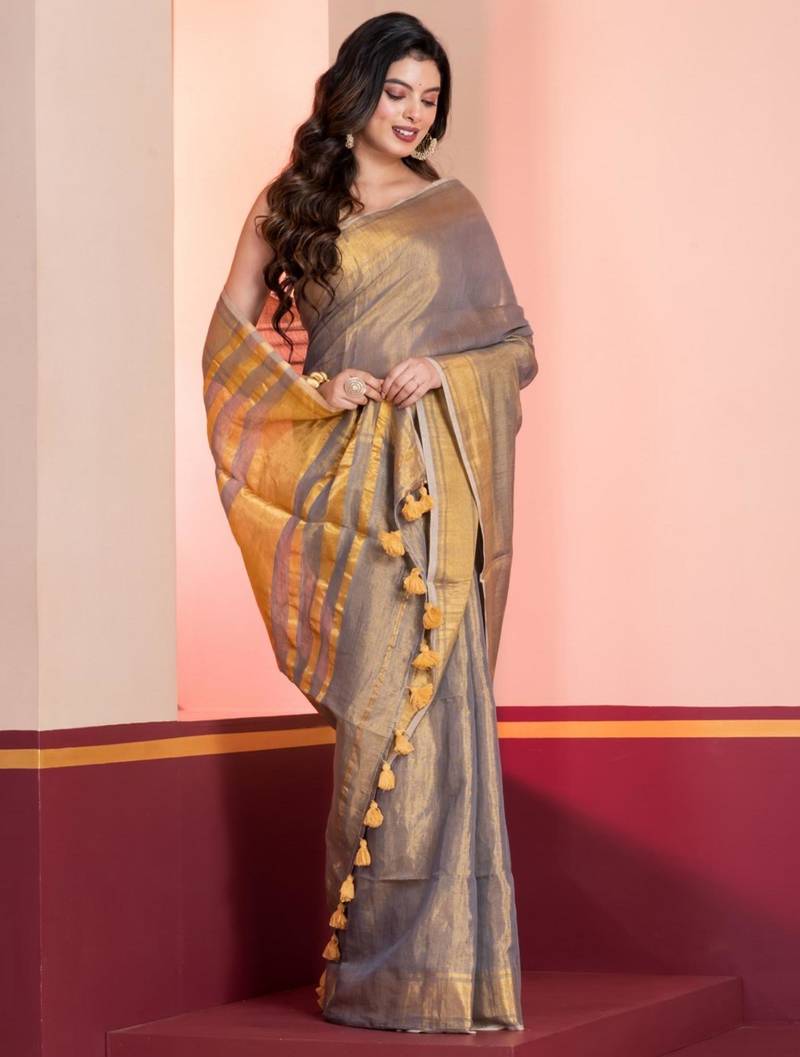 Grey gold dual tone linen tissue saree with zari and tassels, with blouse