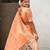 light orange soft organza saree with unstiched blouse