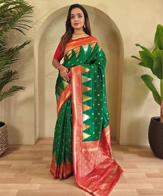 Green woven kanchipuram silk saree with blouse piece 1