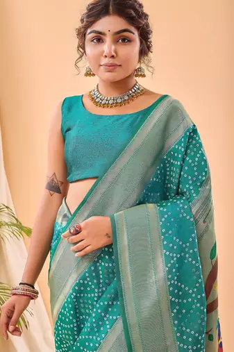 Turquoise woven silk saree with blouse piece