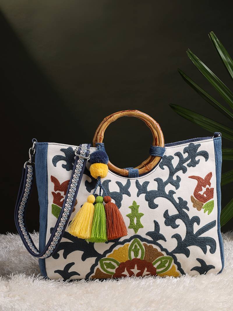 tribal sutra off white canvas floral embroidered handheld bag
