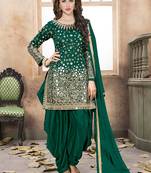 Dark green embroidered mirror work silk patiala suits