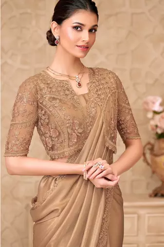 Gold shimmer satin georgette saree with jacket blouse