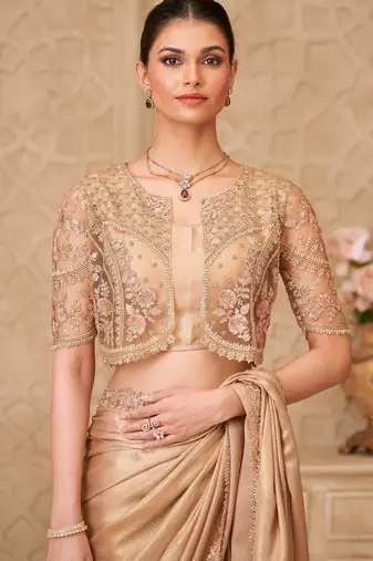 Gold shimmer satin georgette saree with jacket blouse