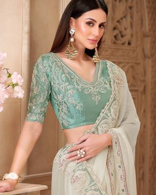 Powder white georgette silk blend saree with satin silk blend blouse 2
