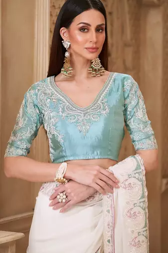 Powder white georgette silk blend saree with satin silk blend blouse
