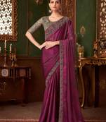 Purple silk saree with beautiful embellishments, paired with an embroidered blouse.