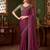 Purple silk saree with beautiful embellishments, paired with an embroidered blouse.