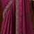 Purple silk saree with beautiful embellishments, paired with an embroidered blouse.