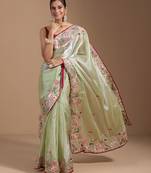 ethnic motifs embroidered georgette saree in green